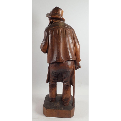 968 - A Black Forrest large carved figure of an old man with pipe, 52cm