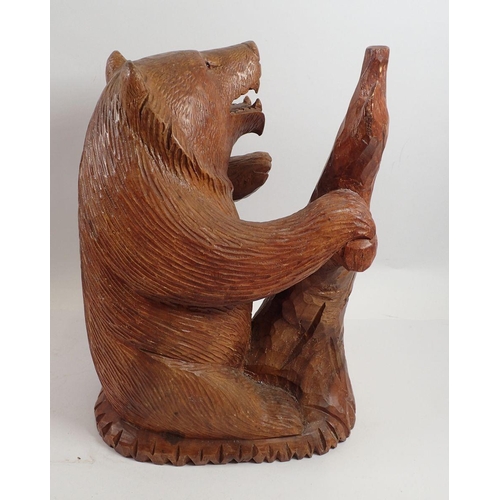 969 - A large Black Forrest carved wooden bear, 35cm tall