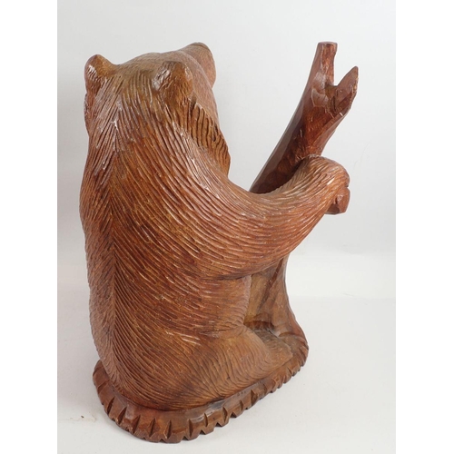 969 - A large Black Forrest carved wooden bear, 35cm tall