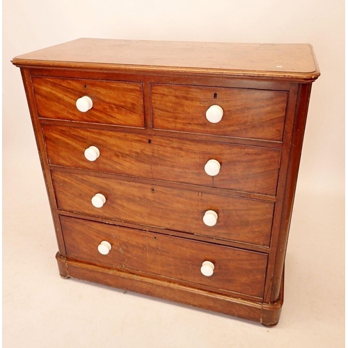 980 - A Victorian mahogany chest of two short and three long drawers, all with china handles, 105cm wide