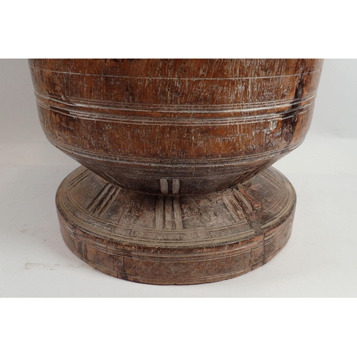 982 - A large turned wood antique bowl - possibly a Wassail bowl, 29cm tall x 26cm diameter on pedestal fo... 