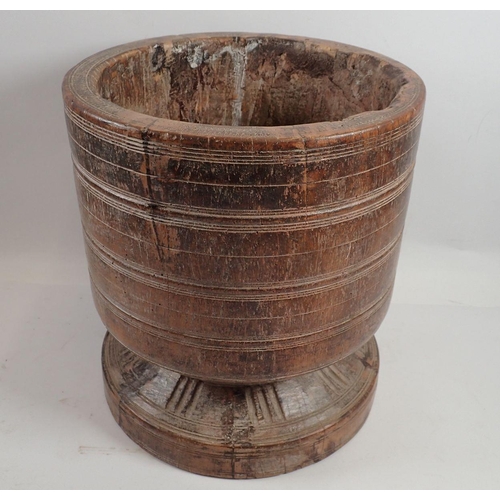 982 - A large turned wood antique bowl - possibly a Wassail bowl, 29cm tall x 26cm diameter on pedestal fo... 