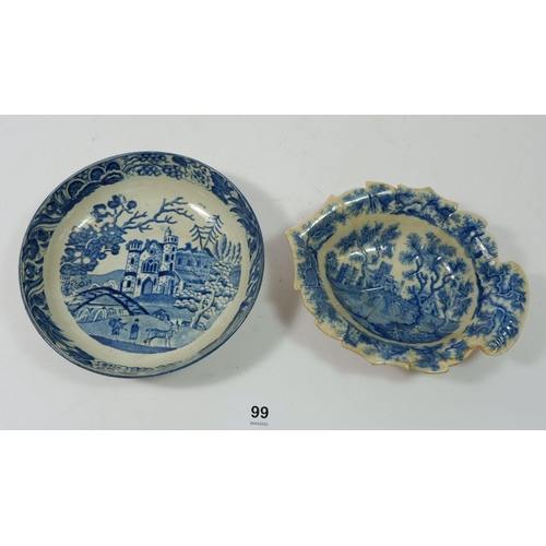 99 - An 18th century blue and white saucer printed castle and deer park and a pickle dish, a/f