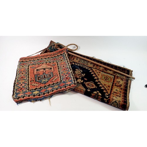 1335 - A Soumak antique saddle bag, 33cm square and a carpet hanging