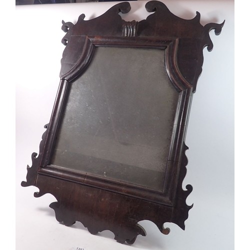 1353 - An early 18th century mahogany framed mirror with fret cut top and apron, 68 x 51cm