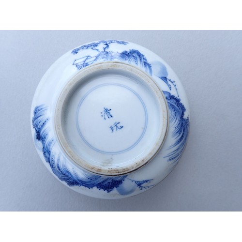 164 - A Chinese blue and white traditional ink paste circular box decorated landscape motifs to top and ba... 