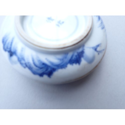 164 - A Chinese blue and white traditional ink paste circular box decorated landscape motifs to top and ba... 