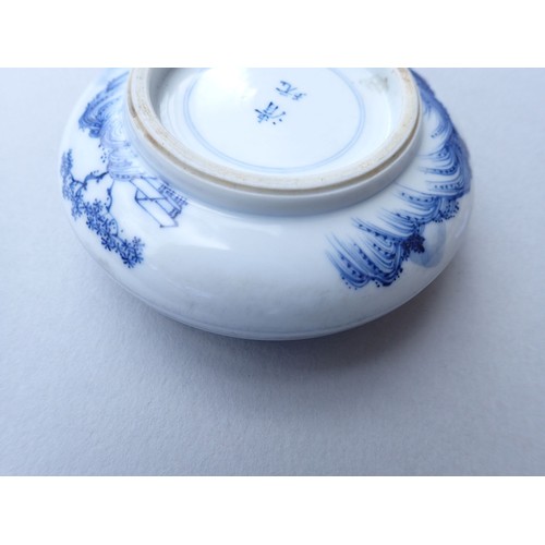 164 - A Chinese blue and white traditional ink paste circular box decorated landscape motifs to top and ba... 