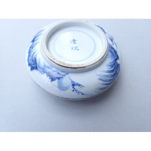 164 - A Chinese blue and white traditional ink paste circular box decorated landscape motifs to top and ba... 