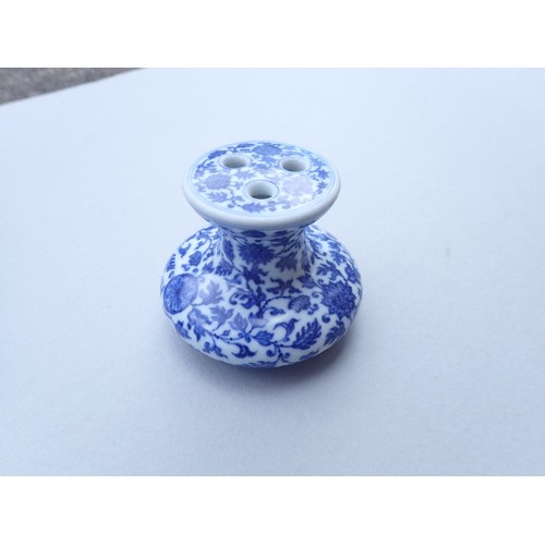 167 - A Chinese Imperial style blue and white incense burner with scrolling floral motifs 