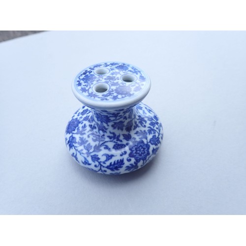 167 - A Chinese Imperial style blue and white incense burner with scrolling floral motifs 