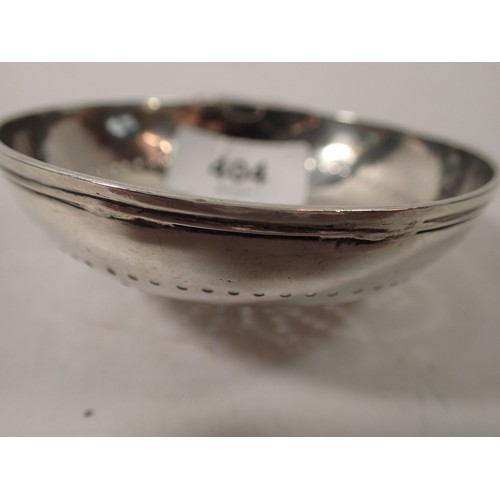 404 - A Georgian silver lemon strainer with floral pierced design, London 1729, 58g, bowl 9cm across