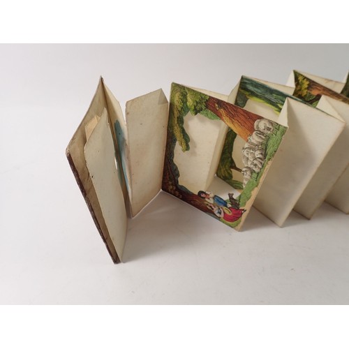 823 - A Victorian Telescopic Peepshow concertina landscape card and a coiled paper novelty push out pictur... 