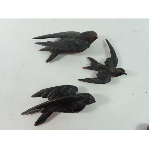 900 - A group of Black Forrest carved and painted swallows