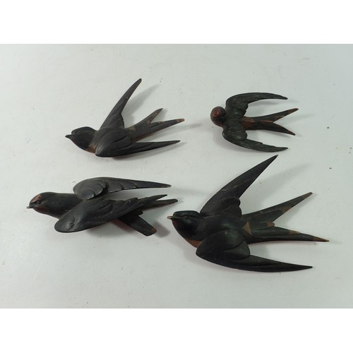 900 - A group of Black Forrest carved and painted swallows