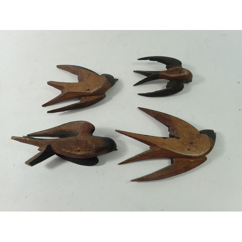 900 - A group of Black Forrest carved and painted swallows