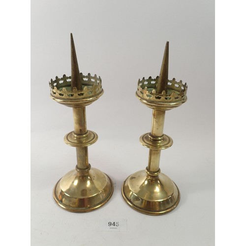 945 - A 19th century pair of brass ecclesiastical candlesticks, 26cm