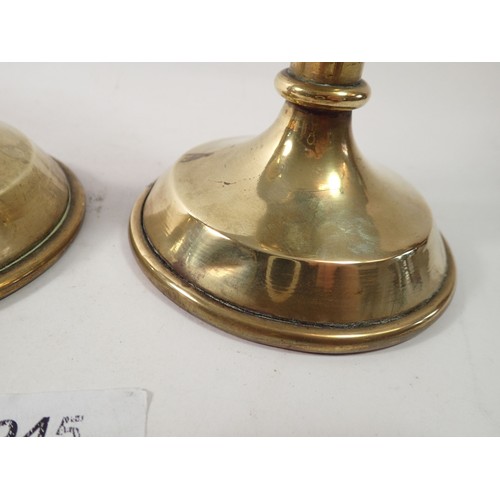 945 - A 19th century pair of brass ecclesiastical candlesticks, 26cm