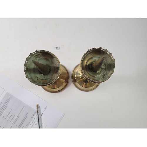 945 - A 19th century pair of brass ecclesiastical candlesticks, 26cm