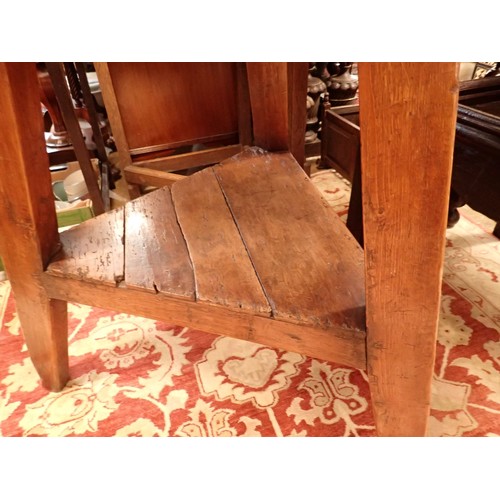 1382 - An 18th century elm topped cricket table with undertier and angular supports, 76cm diameter, 75cm hi... 