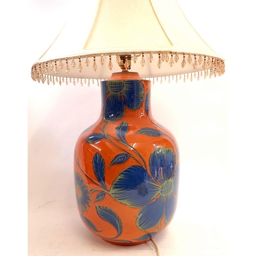 1090 - A large orange and blue floral pottery table lamp, lamp 41cm high