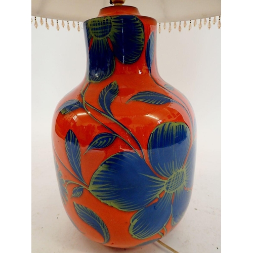 1090 - A large orange and blue floral pottery table lamp, lamp 41cm high