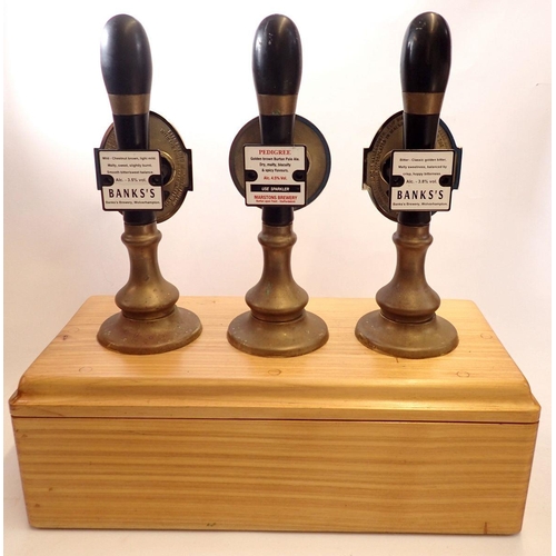 1094 - Three 1950's bar pumps by Caskell Chambers for Banks Bitter, Mild & Pedigree mounted on wooden base,... 