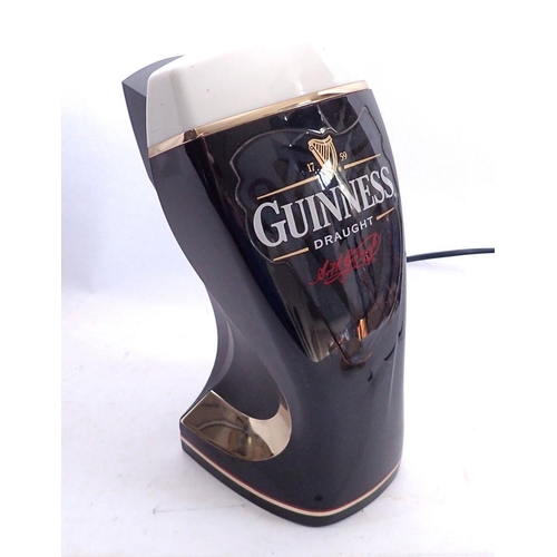 1095 - A Guinness bar lamp, 30cm tall