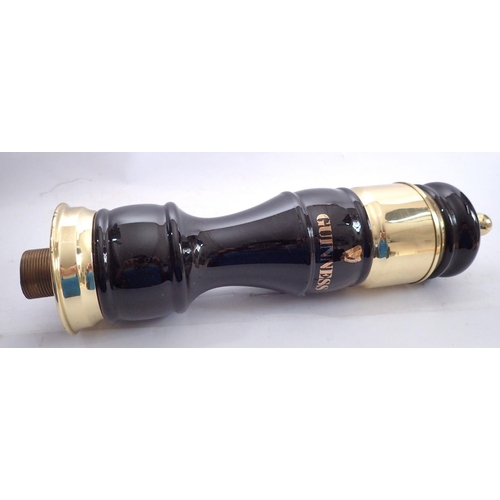 1096 - A Guinness black and gold bar pump with tap, 50cm tall