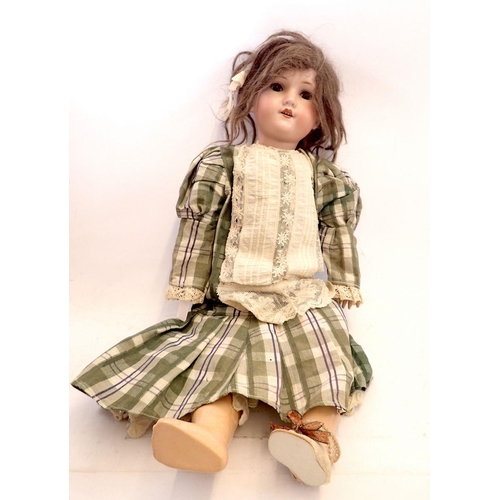 1101 - A German bisque headed doll 'Welsch' No 7 with jointed composition body, with brown hair and sleepin... 