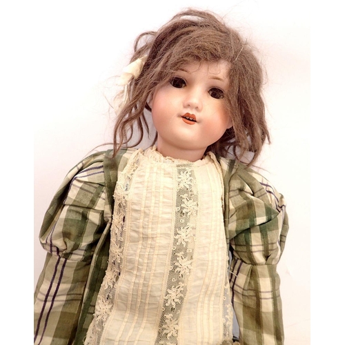 1101 - A German bisque headed doll 'Welsch' No 7 with jointed composition body, with brown hair and sleepin... 