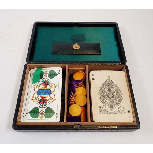 1123 - A leather cased set of old playing cards by Goodall & Son and various counters etc