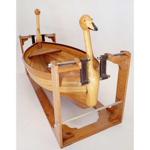 1127 - An unusual wooden childs rocking boat with duck head decoration to ends, 128cm long