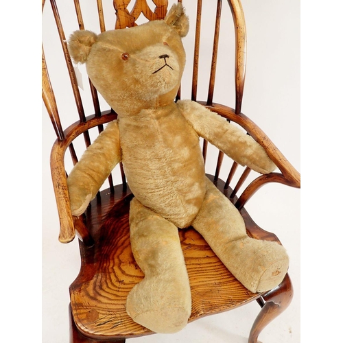 1128 - A large vintage straw filled gold plush teddy, 80cm