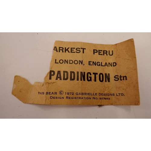 1129 - A Gabrielle Paddington Bear with torn label, 46cm tall