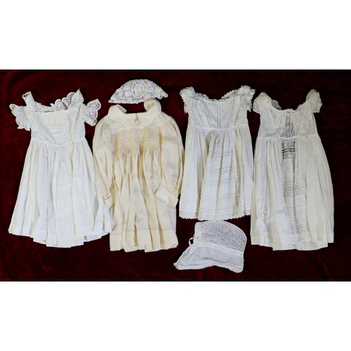 1138 - An Edwardian silk childs dress, three white cotton christening gowns and two bonnets