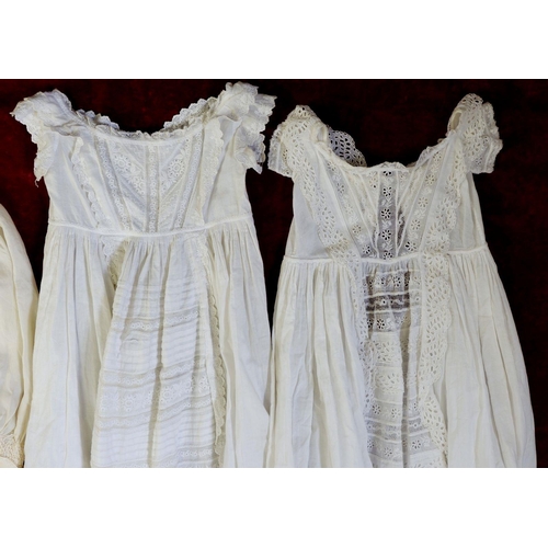 1138 - An Edwardian silk childs dress, three white cotton christening gowns and two bonnets