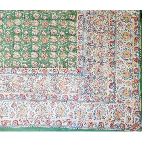 1143 - An embroidered satin tablecloth 125 x 125cm  with Egyptian motifs and a large Indian cotton bedsprea... 