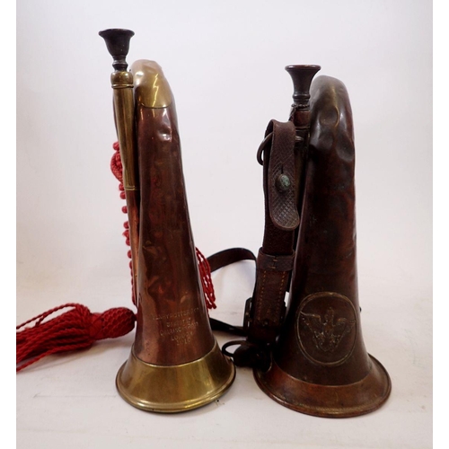 1152 - Two military copper and brass bugles, one by Henry Potter & Co 1916