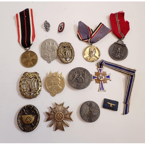 1157 - A collection of thirty two WWII German medals and badges including silver and enamel mother's badge,... 