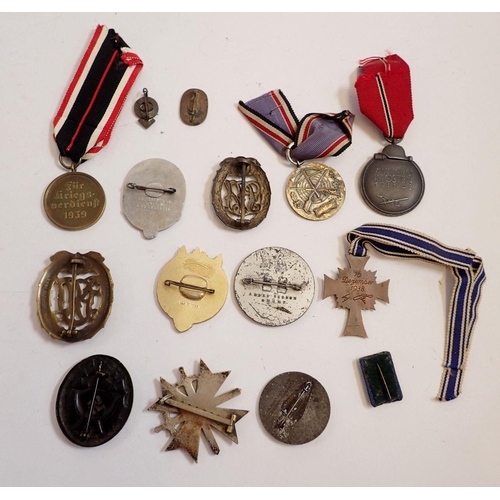 1157 - A collection of thirty two WWII German medals and badges including silver and enamel mother's badge,... 