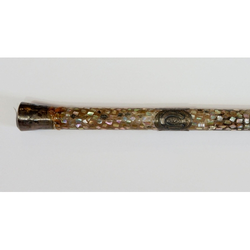 1178 - A mother of pearl and white metal mounted ladies walking cane with horseshoe motif