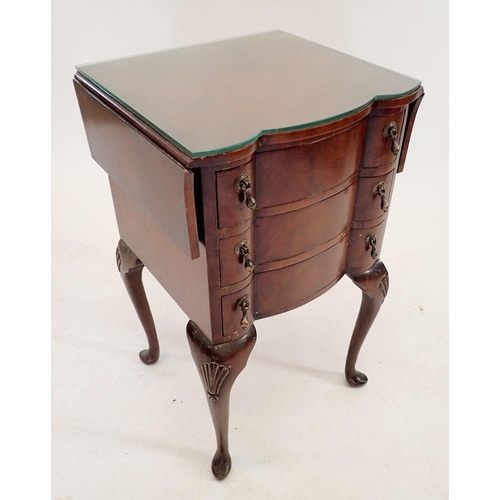 1180 - A mahogany bedside table with drop flaps and three drawers, 69cm tall, 68cm wide once opened