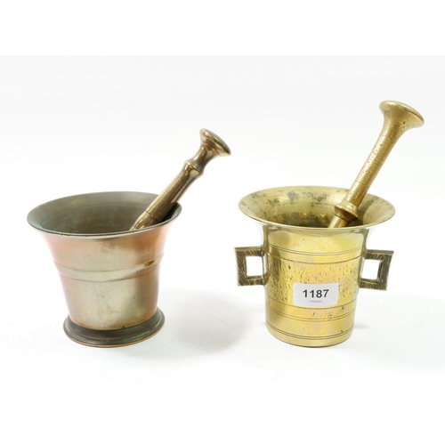 1187 - A brass pestle and mortar and copper pestle and mortar, 16cm tall