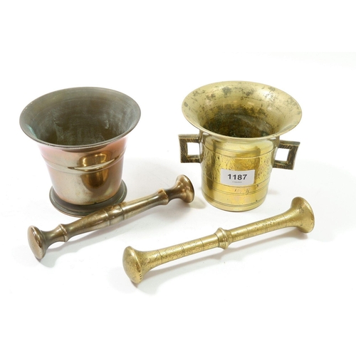 1187 - A brass pestle and mortar and copper pestle and mortar, 16cm tall