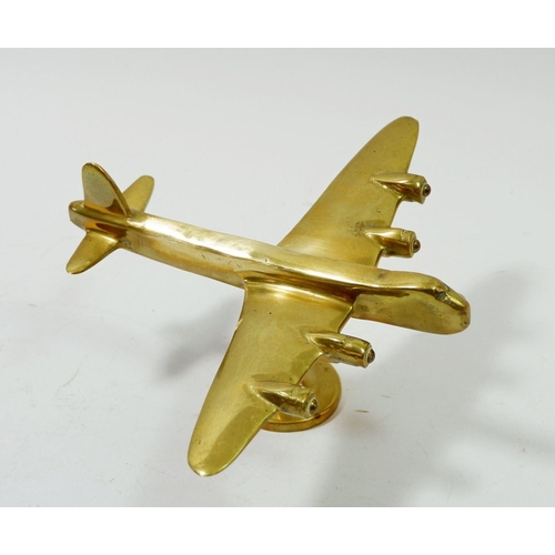 1191 - A brass model of WWII Wellington bomber on stand, 17cm long, 10cm tall