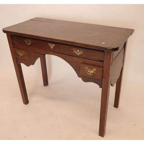 1192 - A Georgian oak low boy with frieze drawer and two small drawers, shaped side apron and square suppor... 