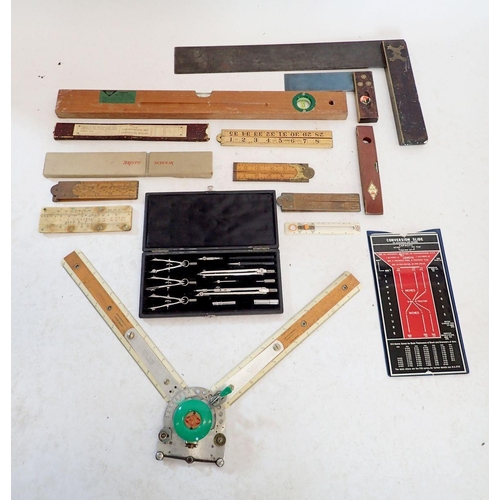 1193 - A collection of draftsman tools including a Halifax Simplon Rabone and Higgins folding ruler, compas... 