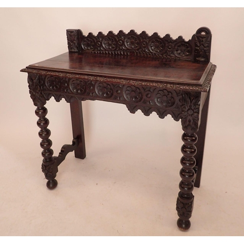 1196 - A Victorian oak Jacobean style hall table with all over carved decoration, end drawer and bobbin tur... 