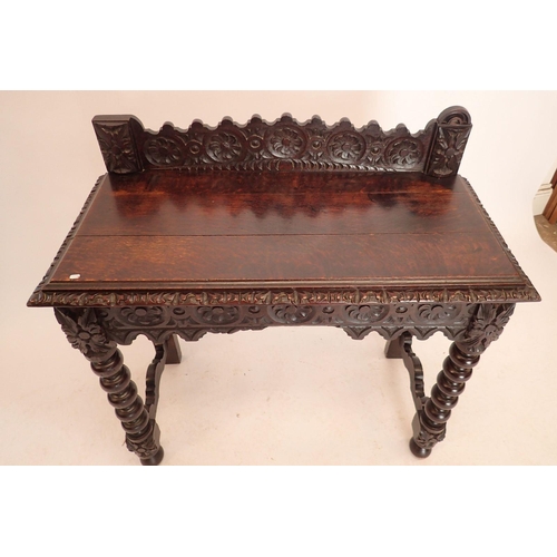 1196 - A Victorian oak Jacobean style hall table with all over carved decoration, end drawer and bobbin tur... 